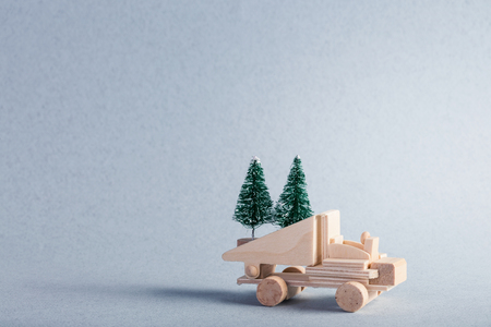 Wooden toy truck with christmas tree on is topの写真素材