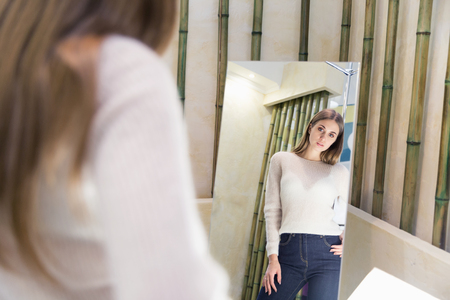 A beautiful woman shopping in a fashion storeの写真素材