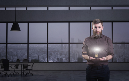 Businessman holding light bulb. 3d render elements in collageの写真素材