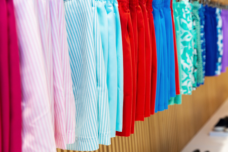 A variety of bright male swimsuits underwear for saleの写真素材