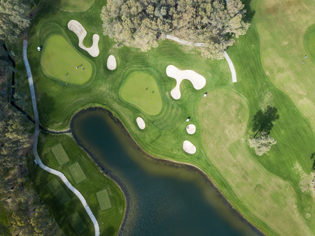 Aerial photo of green golf fields in springの写真素材