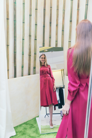 A beautiful woman shopping in a fashion storeの写真素材