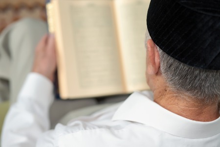 An old man reading the book. Selective focusの写真素材