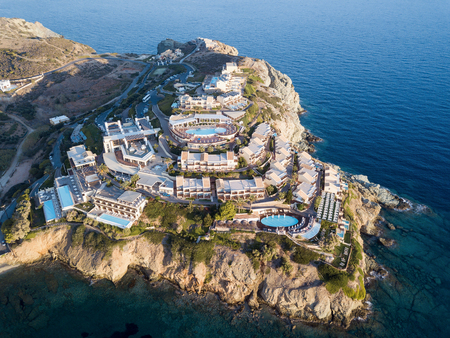 Aerial drone photo of beautiful hotel located on the hill by the seaの写真素材