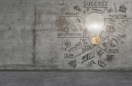 A colorful light bulb and business sketch drawn on a concrete wallの写真素材