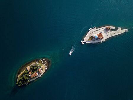 Aerial photo of St. George and monastery on the islands near Perast town in Kotor bay