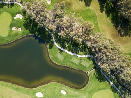 Aerial photo of green golf fields in springの写真素材