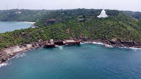 The rusty shipwreck run aground. Sri Lankaの写真素材