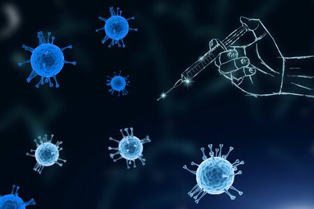 Vaccine for coronavirus. Hand holding a syringe with the medicineagainst the virusの写真素材