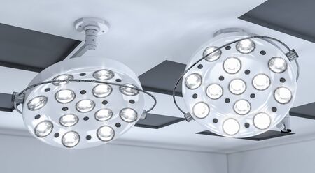 Two surgical lamps on a ceiling in operation room. 3d rendering.の写真素材