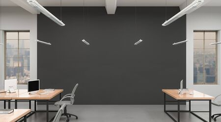 Side view of a spacious office with a grey wall. Rows of tables, equipped workstations. 3d rendering.の写真素材
