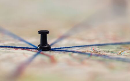 The black pin marks a location on a map with routesの写真素材