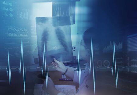 Female doctor study the x-ray of the lungs