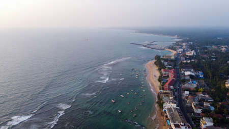 Aerial view of the ocean and the town of Hikkaduwa, Sri Lankaの写真素材
