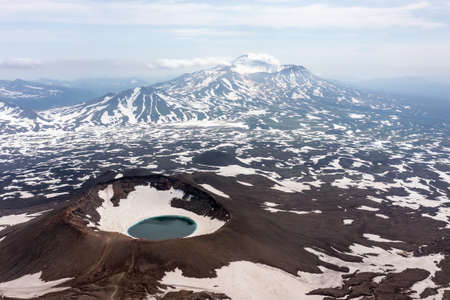 Gorely Volcano crater lake with Mutnovsky Volcano on the background. Kamchatka, Russiaの写真素材