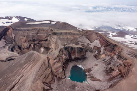 The blue lake in the crater of Gorely volcano. Kamchatka Peninsula, Russiaの写真素材