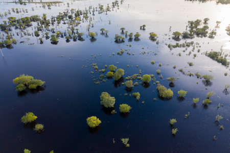 Scenic aerial view of high water in spring time at sunsetの写真素材