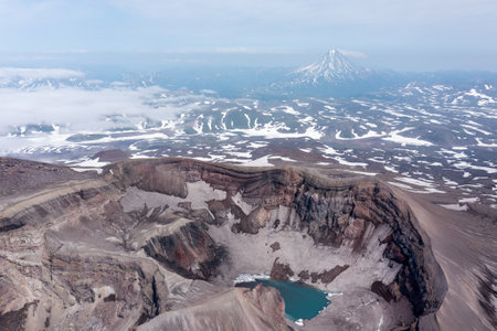 The blue lake in the crater of Gorely volcano. Kamchatka Peninsula, Russiaの写真素材