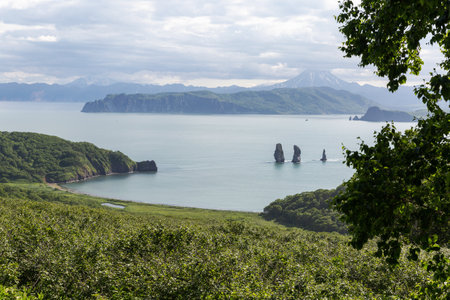Three Brothers is a famous landmark in the Avacha Bay. Kamchatka Peninsula, Russiaの写真素材