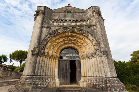 West facade view of Notre-Dame de l'Assomption de Fenioux
church in Charente Maritime region of Franceの写真素材