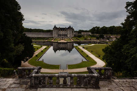 Full view of La Roche-Corubon castle  with gardens and pond in Charente Maritime region of Franceのeditorial素材