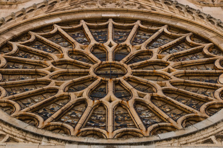 Closeup view of the entrance rose window with its stained glasses in the gothic cathedral of Leon, Spainの写真素材