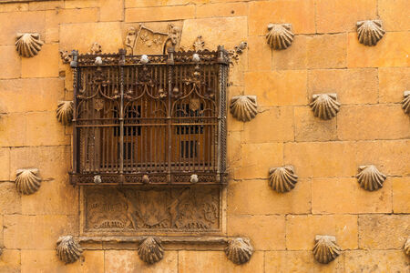 Detail of window with old forge in The House of Shells located in Salamanca Spainの写真素材