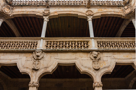 Beautiful stone archs and balcony delicate carving in the House of Shells in the city of Salamanca Spainの写真素材