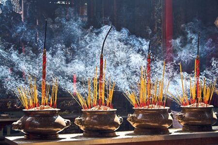 Incense burning in a Buddhist templeの写真素材