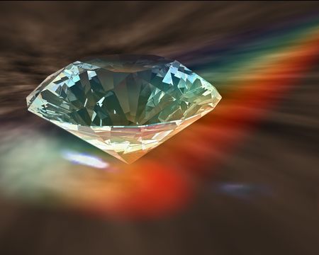A diamond sparkles in rainbow lightsの写真素材