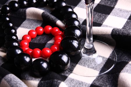 Beads necklaces and glass detail on checkerboard patternの写真素材