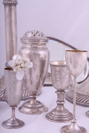 Various antique silver objects in studio lightの写真素材
