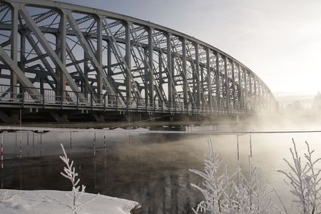 Very cold day, view over a river and bridge