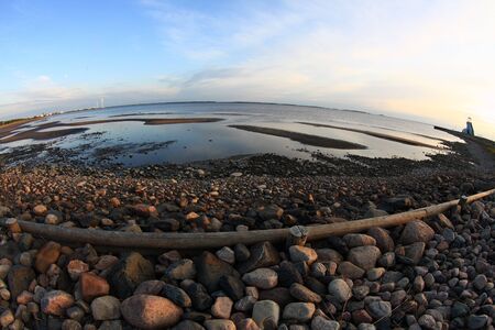 Sunset on the sea shore, fisheye distortionの写真素材