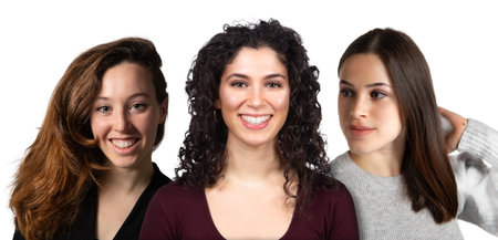 Portrait and collage of three smiling young women with different hair types, isolated on white background. Concept of diversity of physiognomiesの写真素材