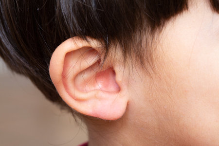 Close up shot little girl right ear with for healthcare and medical conceptの写真素材