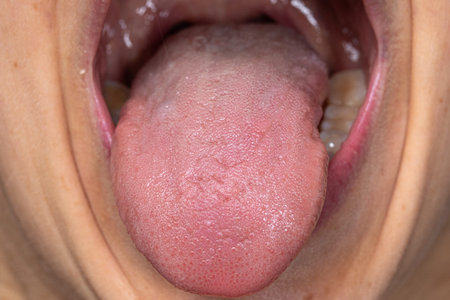 Close up of a woman's mouth with the tongue sticking out.の写真素材