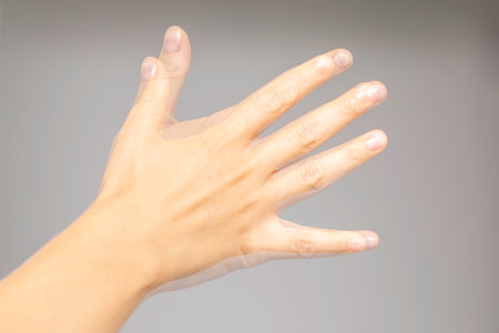 Shaking hand of a person suffering from Parkinson's diseaseの写真素材