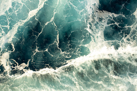 Aerial view of stormy sea waves. Natural background texture.