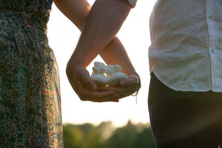 Conceptual image of gender reveal against homophobia: Couple waiting for the birth of their daughter...
