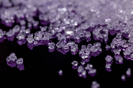 White sugar crystals on a dark violet background, macro, close-upの写真素材
