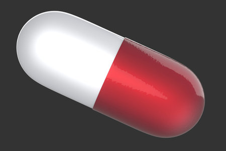 Red and white realistic medical capsule with a drug on a dark gray background. 3d rendering illustrationの写真素材