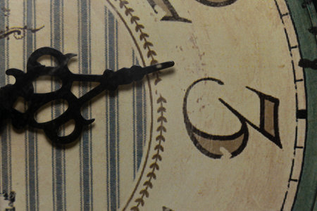 Face of the ancient clock, three o'clock hand, extreme close-up macro viewの写真素材