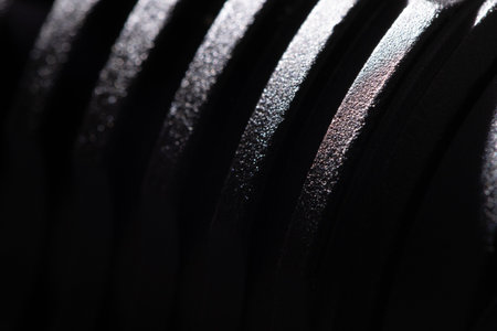 Texture of a black metal part close-up. Black powder metal, macro photography, fine detailの写真素材