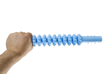 A man's hand holds a blue plastic roller massager for muscle relaxation isolated on white...