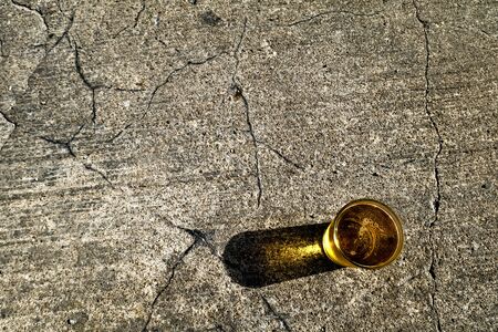 Glass of cold beer sitting on street in summerの写真素材