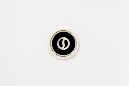 energy saving light bulb on the white ceiling background.
