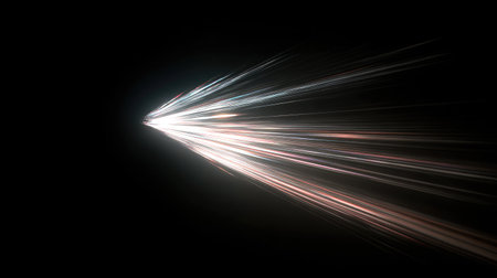 Abstract shot of light beams from a film projector slicing through darknessの素材