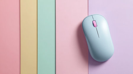 Colorful wireless mouse placed on pastel-colored flat surface backgroundの素材