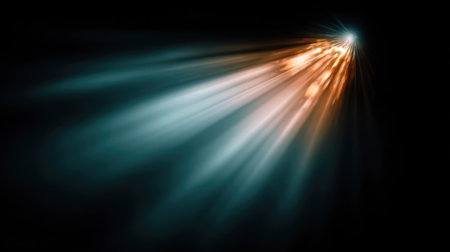 Spotlight flare lens effect captured against a deep black gradient backgroundの素材